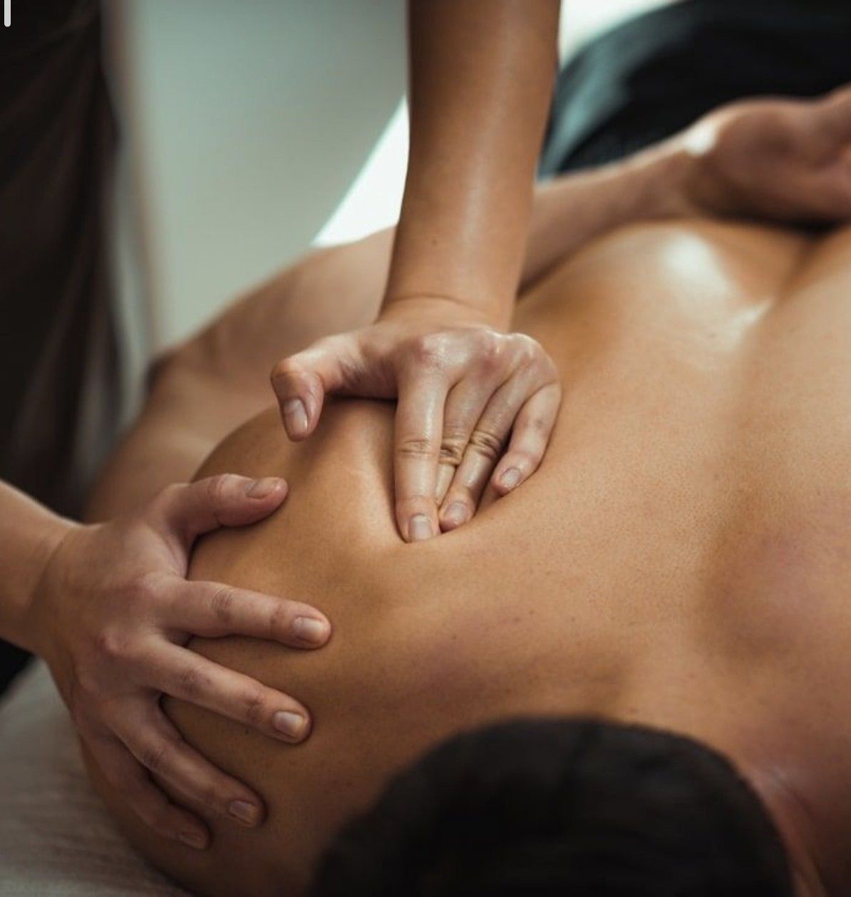 César Natale, lead physiotherapist at NatalePhysio, performing therapeutic exercise